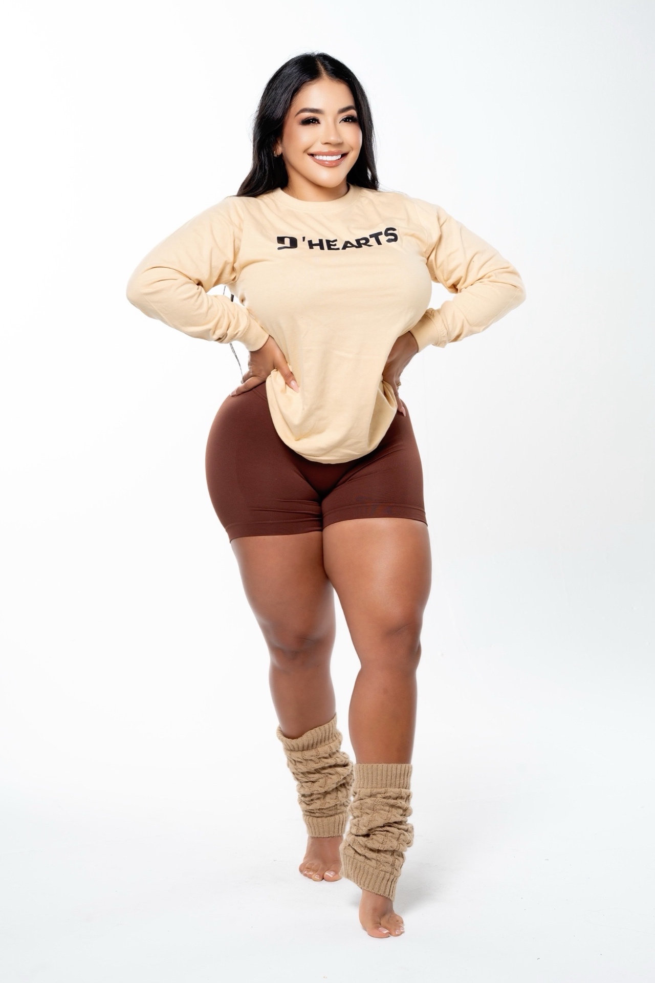 DeAngelis Puerta wearing a cream D'HEARTS long-sleeve tee and brown sculpt shorts