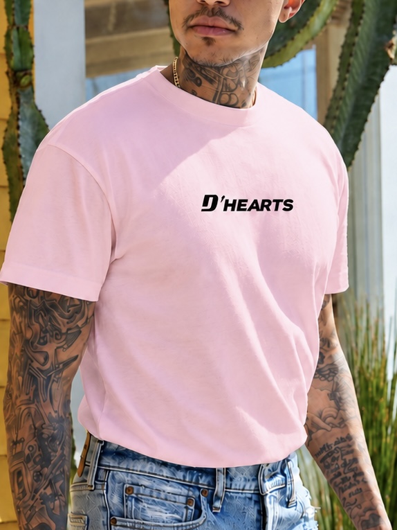 Man wearing a soft pink D'HEARTS unisex tee